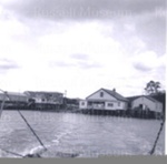 Photo: View from ferry of Opua store and Harbour Board office, c1960; 99/1455/4 Photo: View from ferry of Opua store and Harbour Board office, c1960; 99/1455/4