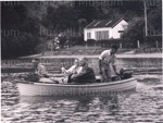 Photo: Edens leaving Otehei, John Shortland at stern, 1957; 97/1527