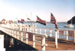 Photo: Flags flying for International Gamefish Tournament, Russell wharf, c1980's; 97/1673