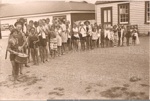 Photo: Russell School pupils (named) on way to swimming class, 1920's; 97/1625