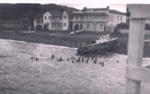 Photo: Russell waterfront showing The Gables boarding house, Duke of Marlborough Hotel and launch "Knoxie" on the beach c1920's; 97/868