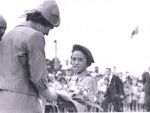 Photo: Queen Elizabeth receiving lowers from Hine Hakaraia, Russell, 1963; 97/1502