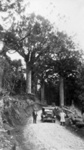 Photo: Whangarei/Russell coast road. ? MacKay and Jack Green in front of the car; 11/159
