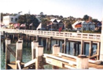 Photo: Flags for International Gamefish Tournament, Russell wharf, c1980's; 97/1674