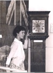 Photo: Girl in Russell Museum with "Old Bill" Grandfather clock c1960; Ian Hanlon; 05/32