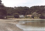 Photo: View of Te Wahapu showing Calvert and Wilkinson houses, 1974; 97/1163