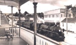 Photo: Main Street, Kawakawa with steam train, c1950; 97/1213