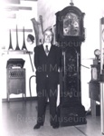 Photo: Mr. Doug Stephenson beside clock he presented to Russell Museum.; 97/761