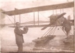 Photo: Mr. Russell receiving mail, first aerial mail, Auckland-Russell, 1920; 97/713