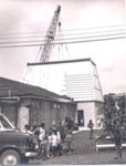 Photo: Roof going on Ship Wing, in foreground Barbara Shortland and her class from Russell school; 1970; 97/1589