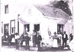 Photo: TR Williams Butchery, WJ Williams on horse, TR Williams at corner of building with white moustache; 13/132
