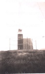 Photo: Flagstaff at Russell showing attempts to cut it down, 1954; 97/1172