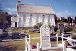 Postcard: Christ Church, Russell, showing headstone for HMS "Hazard" victims; 11/26