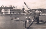 Photo: Crane on Russell wharf, with launch "Doris" and waterfront in background; 97/892