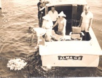 Photo: H.W. (Peter) Williams ashes being scattered and wreath being laid by Mervyn Arlidge from "Alma G II", 1950; 97/691