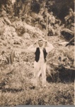 Two photos: a) man with mako shark jaw. b) man with gamefish, Russell wharf.; 97/646