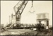 Photograph: Floating crane carrying bridge approaching the Western Vehicular Ferry Landing, 1929.; Auckland Harbour Board. Engineer's Dept.; 2010.132.207