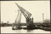 Photograph: Floating crane lifting new pile driver frame onto its punt, 1922.; Auckland Harbour Board. Engineer's Dept.; 2010.132.263
