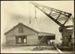 Photograph: Shed 12 removal by floating crane from Central Wharf to North Wall, 1921.; Auckland Harbour Board. Engineer's Dept.; 2010.132.261