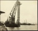 Photograph: Floating crane lifting 80 foot concrete tower, 1922.; Auckland Harbour Board. Engineer's Dept.; 2010.132.265