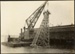 Photograph: Floating crane upending pile driver frame, 1913.; Auckland Harbour Board. Engineer's Dept.; 2010.132.226