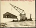Photograph: Shed removal by floating crane from Quay Street Jetty No. 3 to west side of Central Wharf, 1917.; Auckland Harbour Board. Engineer's Dept.; 2010.132.251