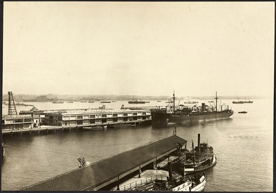 Photograph: Construction of Princes Wharf, with MS HAURAKI (1922) alongside, 1924.; Auckland Harbour Board. Engineer's Dept.; 2010.132.55