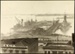 Photograph: Construction of Princes Wharf, with warship HMS HOOD (1920) alongside, 1924.; Auckland Harbour Board. Engineer's Dept.; 2010.132.62