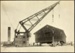 Photograph: Floating crane taking Shed 8 from Quay Street Landings to Western Wharf, 1922.; Auckland Harbour Board. Engineer's Dept.; 2010.132.240