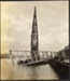 Photograph: Floating crane upending pile driver frame, 1913.; Auckland Harbour Board. Engineer's Dept.; 2010.132.227