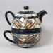 Cup and teapot set - Tapa pattern; Studio Ceramics NZ Ltd; 2002; 2017.1.6
