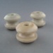 Bobbin insulators; Crown Lynn Technical Ceramics Limited; 1930-1965; 2009.1.1296.1-3