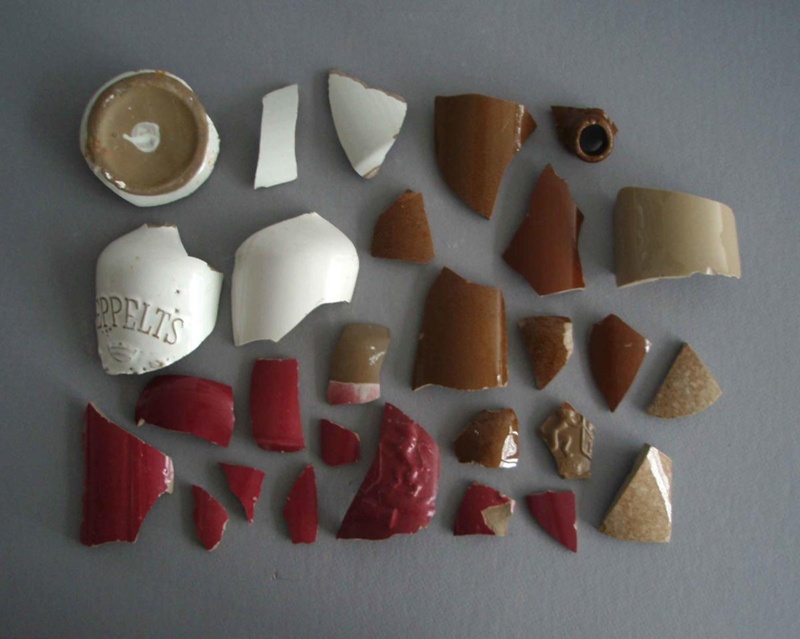 Ceramic bottle shard x 28; Crown Lynn Potteries Limited; 1940-1960; 2009.1.2050.1-28 Ceramic bottle shard x 28; Crown Lynn Potteries Limited; 1940-1960; 2009.1.2050.1-28