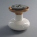 Door handle and rose; Crown Lynn Technical Ceramics Limited; 1976-1989; 2008.1.684