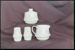 Negative - Classique cream jug, sugar bowl, two shakers with simple botanical pattern on cloth background; 16 Aug 1987; 2008.1.3096