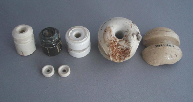 Insulators and insulator fragments; Crown Lynn Technical Ceramics Limited; 1950-1980; 2009.1.1703.1-7