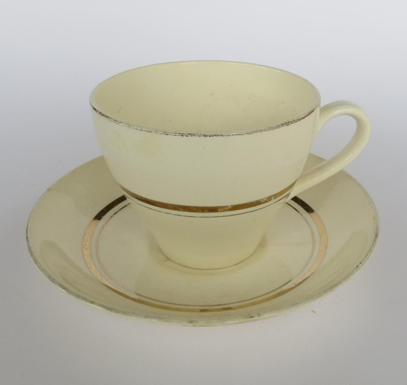 Cup and saucer - Gay gold pattern; Crown Lynn Potteries Limited; 1955-1969; 2016.48.78