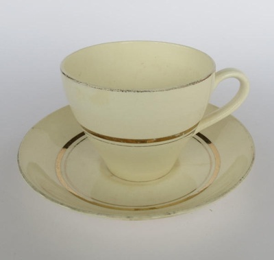 Cup and saucer - Gay gold pattern; Crown Lynn Potteries Limited; 1955-1969; 2016.48.78