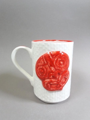 Mug - hei-tiki face; Studio Ceramics NZ Ltd; 2007; 2017.1.120