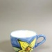 Cup - yellow flower; Studio Ceramics NZ Ltd; 1998-2004; 2017.1.95