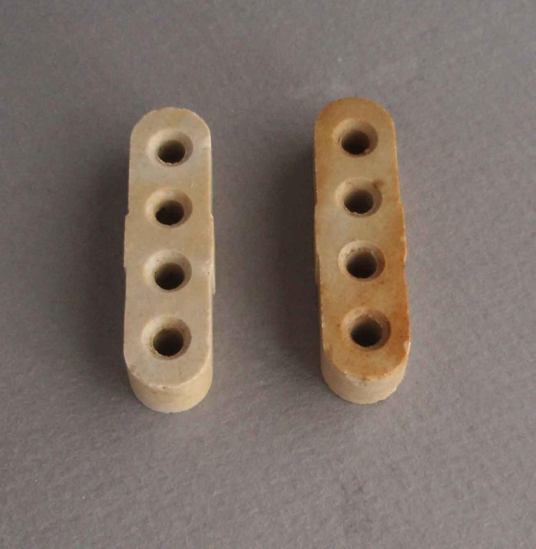 Pair of electrical insulators; Crown Lynn Technical Ceramics Limited; 1940-1980; 2010.1.44.1-2