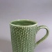 Mug - Hei-Tiki; Studio Ceramics NZ Ltd; 2007; 2017.1.102