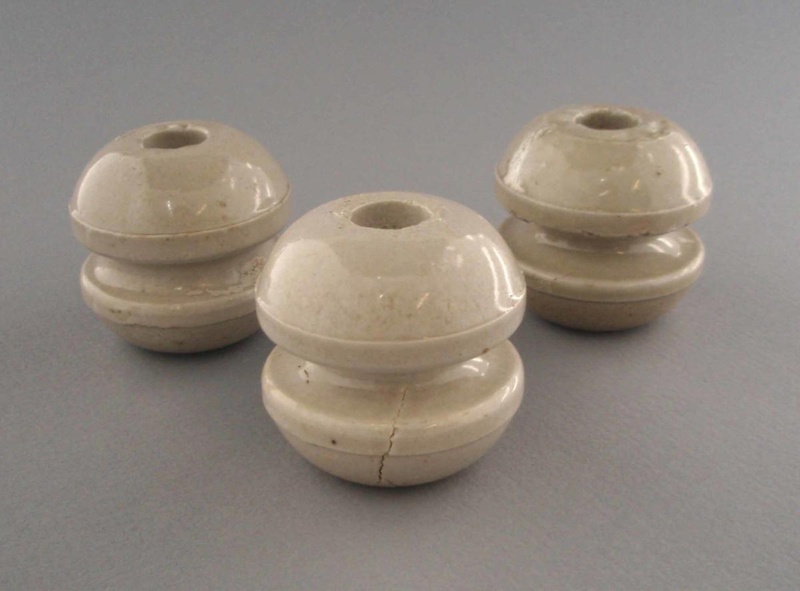 Bobbin insulators; Crown Lynn Technical Ceramics Limited; 1930-1965; 2009.1.1302.1-3