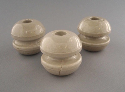 Bobbin insulators; Crown Lynn Technical Ceramics Limited; 1930-1965; 2009.1.1302.1-3