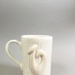 Mug - fish hook; Studio Ceramics NZ Ltd; 2007; 2017.1.103