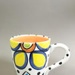 Cup - dots and flowers; Studio Ceramics NZ Ltd; 1991-1995; 2017.1.93