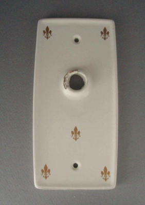 Door handle finger plate - Fleur de lis; Crown Lynn Technical Ceramics Limited; 1967-1987; 2008.1.1342