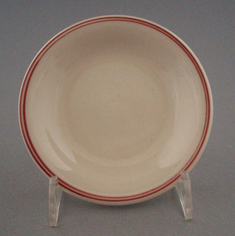 Butter pat; Crown Lynn Potteries Limited; 1960-1980; 2009.1.230 Butter pat; Crown Lynn Potteries Limited; 1960-1980; 2009.1.230