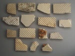 Floor tile fragments x15; Amalgamated Brick and Pipe Company Limited; 1930-1960; 2009.1.1597.1-15