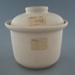 Casserole and lid - bisque; Crown Lynn Potteries Limited; 1977-1989; 2009.1.764.1-2